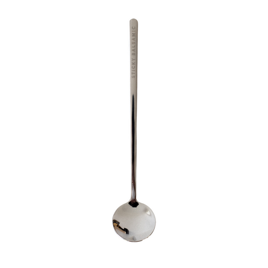Sticky Balsamic Spoon presented on a white background