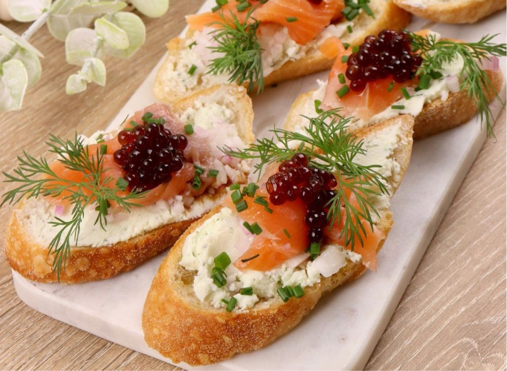 Canapes with smoked salmon, dill, cheese on sourdough and Sticky Balsamic Pearls