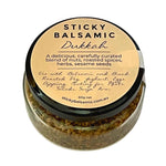 Sticky Balsamic Dukkah showing the top of the jar which has serving suggestions.