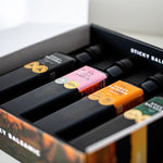Sticky Balsamic Gift Box showing an open close up photo of the gift box with four bottles in it. The focus is in the middle of the gift box showing photographic artistry with a white background.