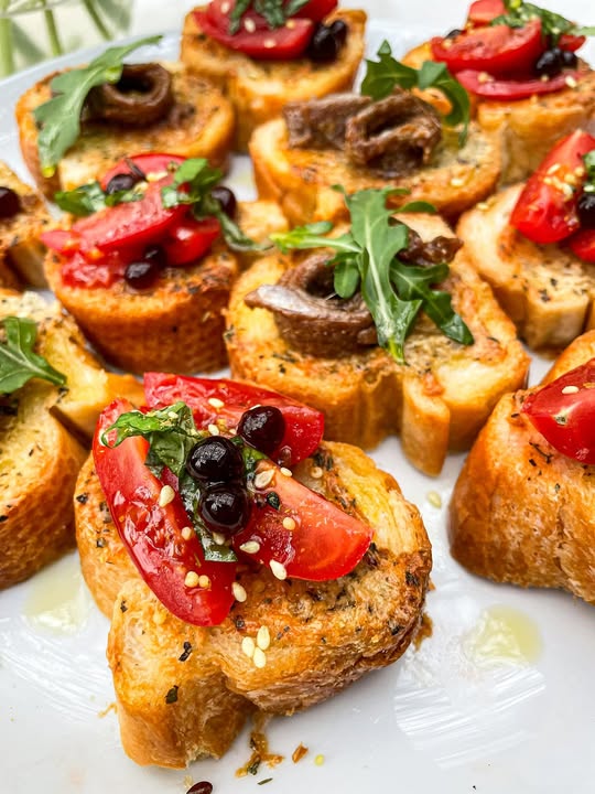 Garlic Parmesan Toasts with Anchovies, Rocket and Tomato Basil Toppings and sticky Balsamic Pearls