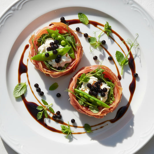 Spring Pea and Prosciutto Nest Salad with Sticky Balsamic Premium Fig Pearls, featuring crispy prosciutto nests filled with fresh pea shoots, snap peas, ricotta cheese, and delicate 7mm balsamic pearls with thick syrupy balsamic drizzle on white plate