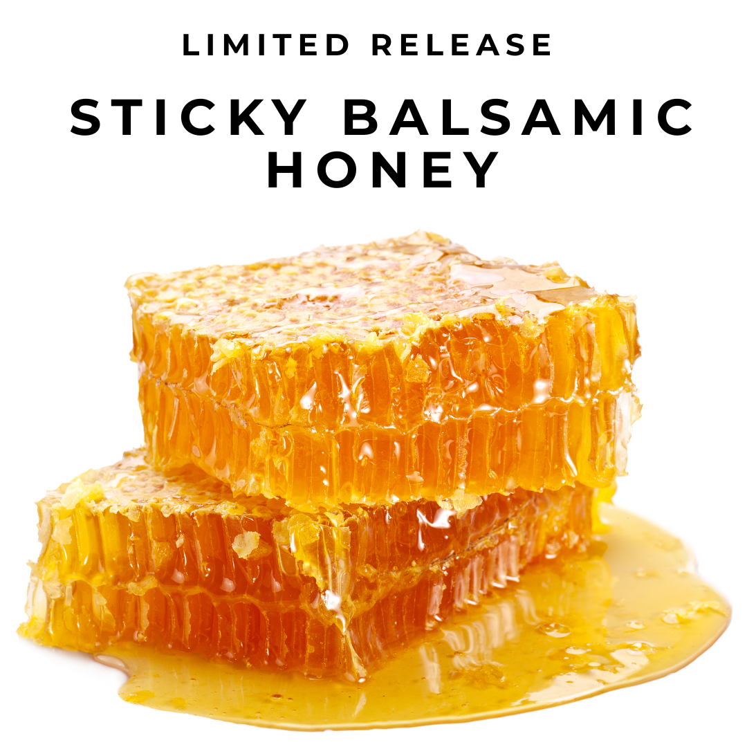 Sticky Balsamic Honey show honeycomb with honey dripping off it on a white background