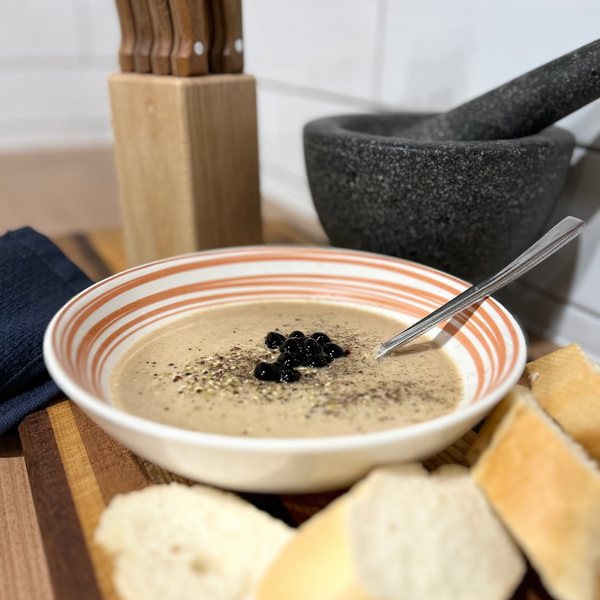 Sticky balsamic pearls garnishing cauliflower soup
