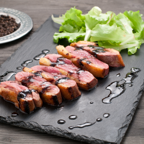 Steak with Sticky Balsamic on a slate tile with lettuce