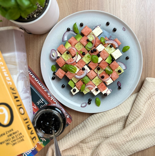 bright watermelon and feta checkerboard salad with sticky balsamic pearls as a garnish