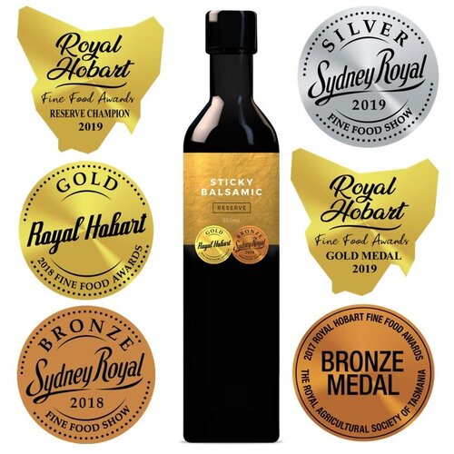 Sticky balsamic reserve bottle with award seals on the front label